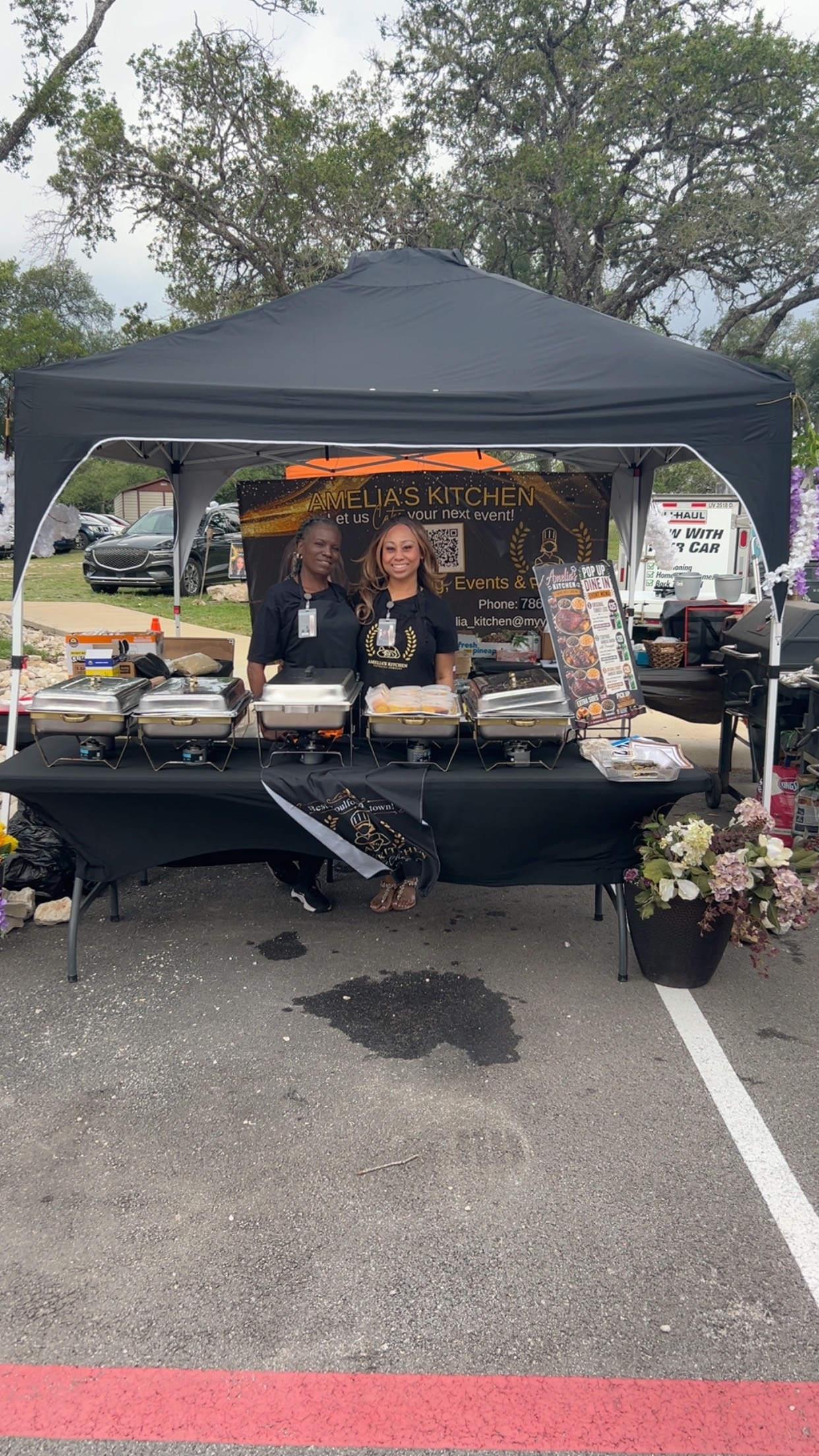 Amelia's Kitchen team and buffet service set up beneath an outdoor tent