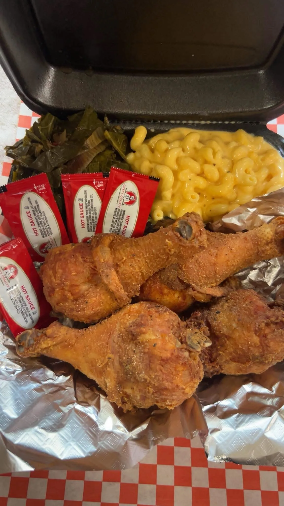 Fried chicken with mac and cheese and collard greens